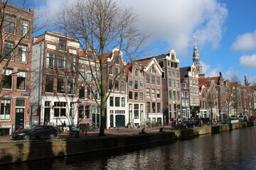 old brick houses and canal in amsterdam (the netherlands) 