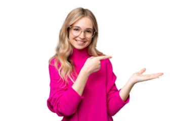 Young English woman over isolated background holding copyspace imaginary on the palm to insert an ad
