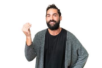 Young man with beard over isolated chroma key background making Italian gesture