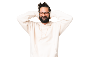 Young man with beard over isolated chroma key background frustrated and covering ears