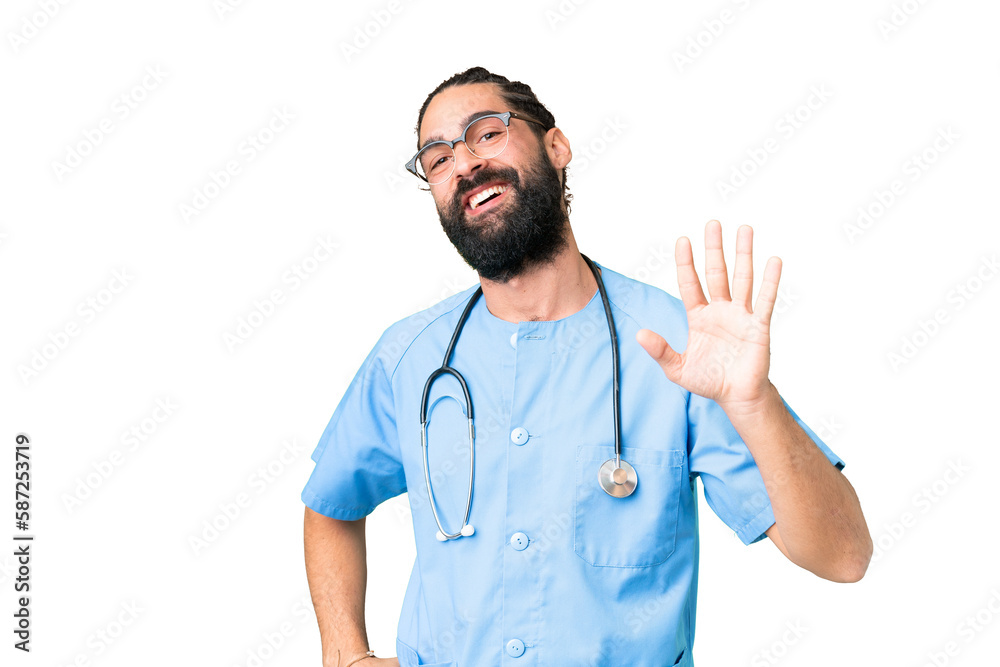 Wall mural Young doctor man over isolated chroma key background saluting with hand with happy expression