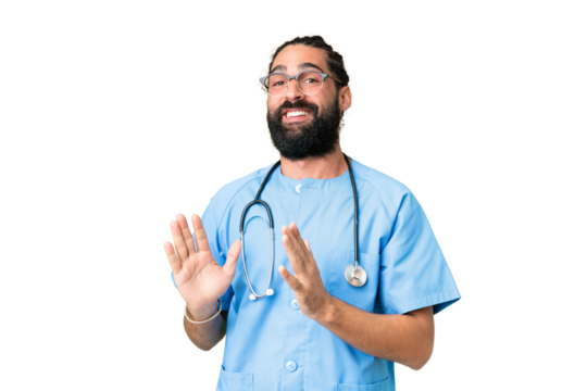 Young doctor man over isolated chroma key background applauding after presentation in a conference