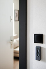 Electric combination lock with a keypad near the entrance door to the apartment.