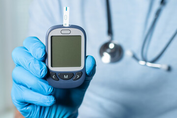 Diabetes concept. Doctor shows glucometer with glucose level. Mockup