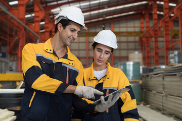 Manufacturing industrial concept. Male and female engineer workers working at manufacturing...