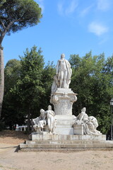 Fototapeta na wymiar Marble monument in the Borghese garden in Rome, Italy.