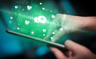 Close-up of a touchscreen with healthcare icons