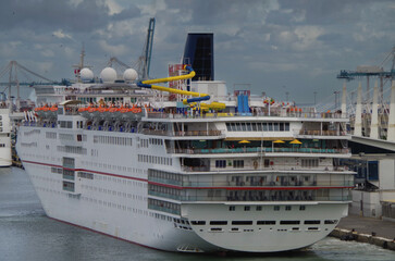 Family fun cruiseship or cruise ship liner Sensation during misty twilight in port of Miami,...