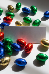 card mockup and colorful chocolate eggs for easter