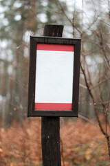 Mock-up of the wooden road sign in the forest. 