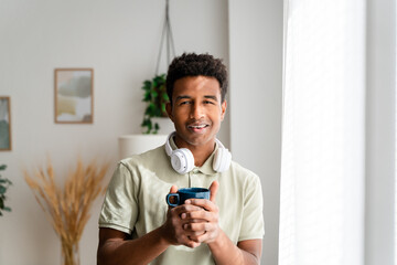 Cheerful black woman with cup of coffee