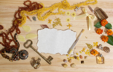 Yellow and Brown Jewelry and Decorations with Vintage Key and Blank Paper With Burned Edges