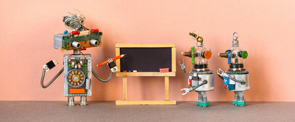 Education graduation concept. Toy robot teacher professor and the child robotic students. University classroom with black chalkboard. Machine learning artificial intelligence.