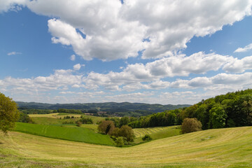 beautiful landscape in summer with fields and meadows in Odenwald region in Germany