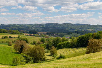 Obraz premium beautiful landscape in summer with fields and meadows in Odenwald region in Germany