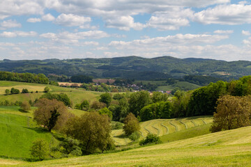 Fototapeta na wymiar beautiful landscape in summer with fields and meadows in Odenwald region in Germany