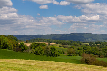 Fototapeta na wymiar beautiful landscape in summer with fields and meadows in Odenwald region in Germany