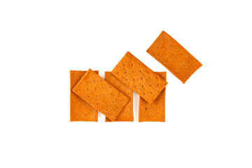 Crisps with tomato and paprika on white background, top view. Wholegrain crispbread, rye crisp. Design element, copy space. Crispy rye bread. Dehydrated dried food