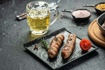 Grilled sausage and beer. Traditional Oktoberfest menu. Food recipe background. Close up