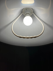 A lighted night lamp with an energy-saving LED bulb during an energy crisis