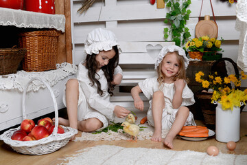 Happy easter! funny funny children with  chicks  getting ready for holiday