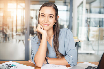 Woman designer, portrait and smile at desk in office for paperwork, pride or expert engineering in...