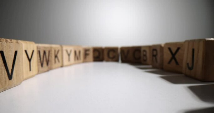 Cubes or blocks of word with letters randomly on white background. Concept of school education or self-education