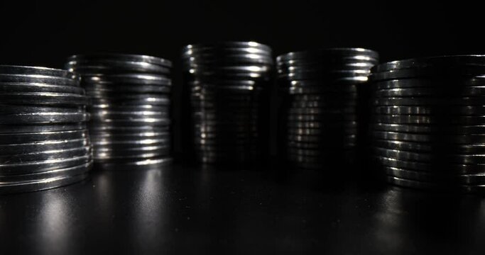 Lots of stack of coins on black background and financial concept. Inflation economic world crisis and devaluation