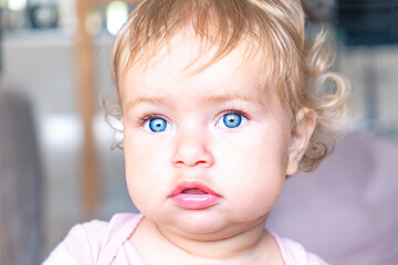 Little baby girl portrait. Adorable baby with blue eyes. 