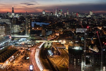 Fototapeta na wymiar elevated view at night of east london looking towards the city with traffic in foreground