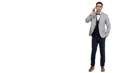 The man calls on the phone. A businessman in a light suit. A man on a white background with a phone. The businessman solves issues by phone.
