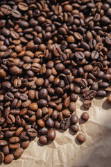 Coffee beans on brown paper background, can be used as a background