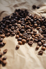 Coffee beans on brown paper background, can be used as a background