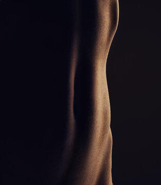 Nude, stomach and silhouette, woman and closeup, sexy and dark aesthetic, art with skin and sensual on black background. Body, beauty and creative with seduction, desire and naked female in studio