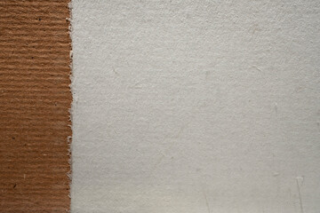 Handmade artisan eco paper with deckled edges and natural fibres texture