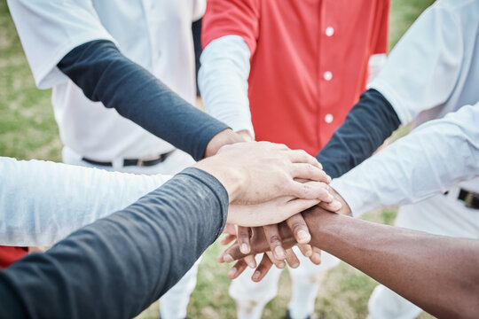 Hands, motivation or baseball people in huddle with support, hope or faith on sports field in game together. Closeup of teamwork, collaboration or group of softball athletes with goals or solidarity