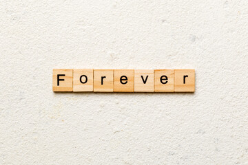 forever word written on wood block. forever text on table, concept