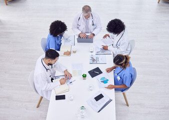 Doctors, nurses or hospital meeting on laptop for research, teamwork or workshop innovation of medicine. Medical planning, men or healthcare diversity women on technology collaboration in top view