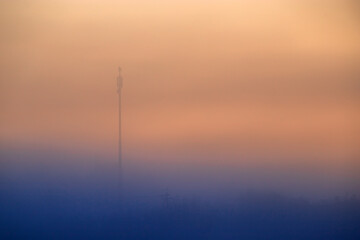 Silhouette of old electrical lines, old telephone cables and light at the golden hour on the sunrise.