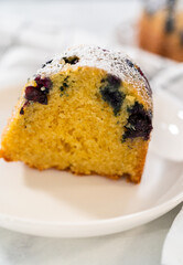 Lemon blueberry bundt cake with powdered sugar dusting