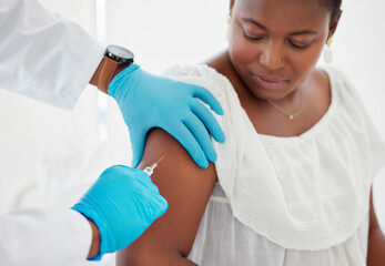 Doctor, hands and patient arm injection for covid vaccination, booster shot or immunity at hospital. Hand of a medical professional holding client arms for needle prick, vaccine or treatment for cure