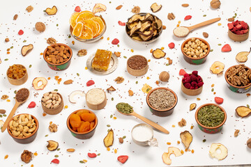 
Healthy vegetarian food concept. Assortment of dried fruits, nuts and seeds on white background. Top view.
