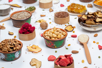 
Healthy vegetarian food concept. Assortment of dried fruits, nuts and seeds on white background. Top view.
