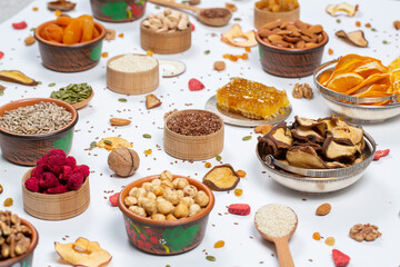 
Healthy vegetarian food concept. Assortment of dried fruits, nuts and seeds on white background. Top view.
