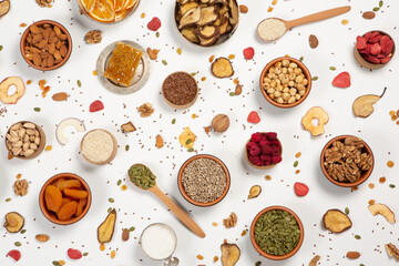 
Healthy vegetarian food concept. Assortment of dried fruits, nuts and seeds on white background. Top view.
