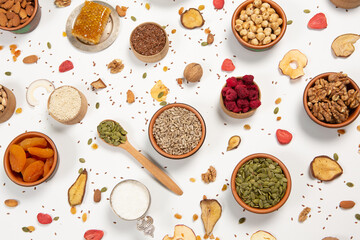 
Healthy vegetarian food concept. Assortment of dried fruits, nuts and seeds on white background. Top view.
