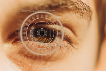 Close-up of a male eye with visual effects. The concept of a sensor implanted in the human eye....