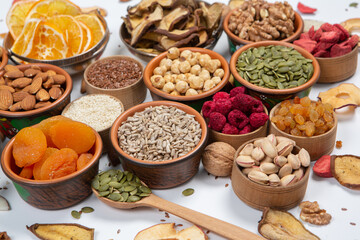 Organic Healthy Assorted Dried Fruit Mix close up. Dried fruit snacks. dried apples, mango, feijoa, dried apricots, prunes top view