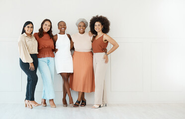 Portrait, teamwork and business women smile in office standing together by white wall mockup. Happiness, diversity and group of friends, employees or staff with cooperation or workplace collaboration - obrazy, fototapety, plakaty