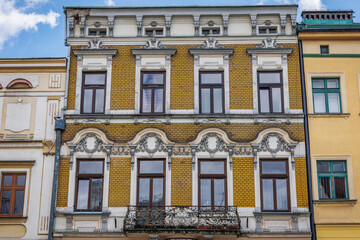 Fototapeta na wymiar Facade of yellow house on Old Town Market Square in historic part of Cieszyn, Poland